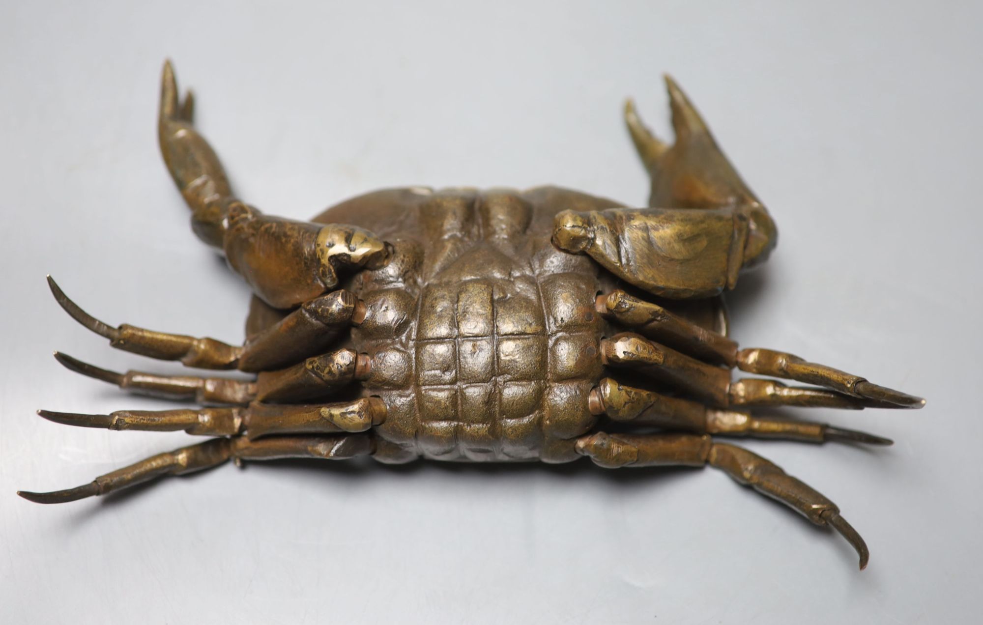 A mid 20th century bronze articulated model of a crab, with hinged carapace, 26cm across